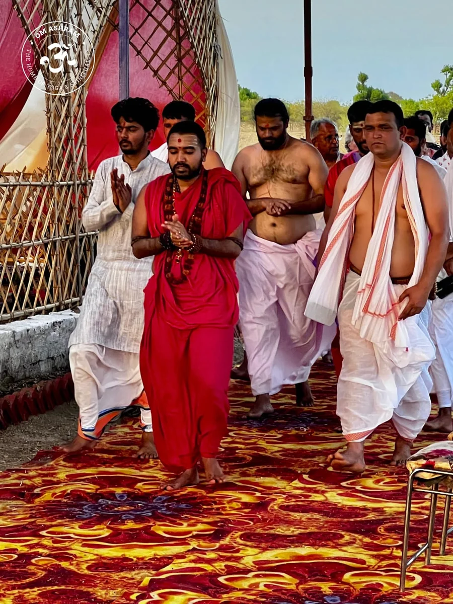 Participants of the Mahamrityunjaya Mahayajna performing parikrama around the yagya shala.